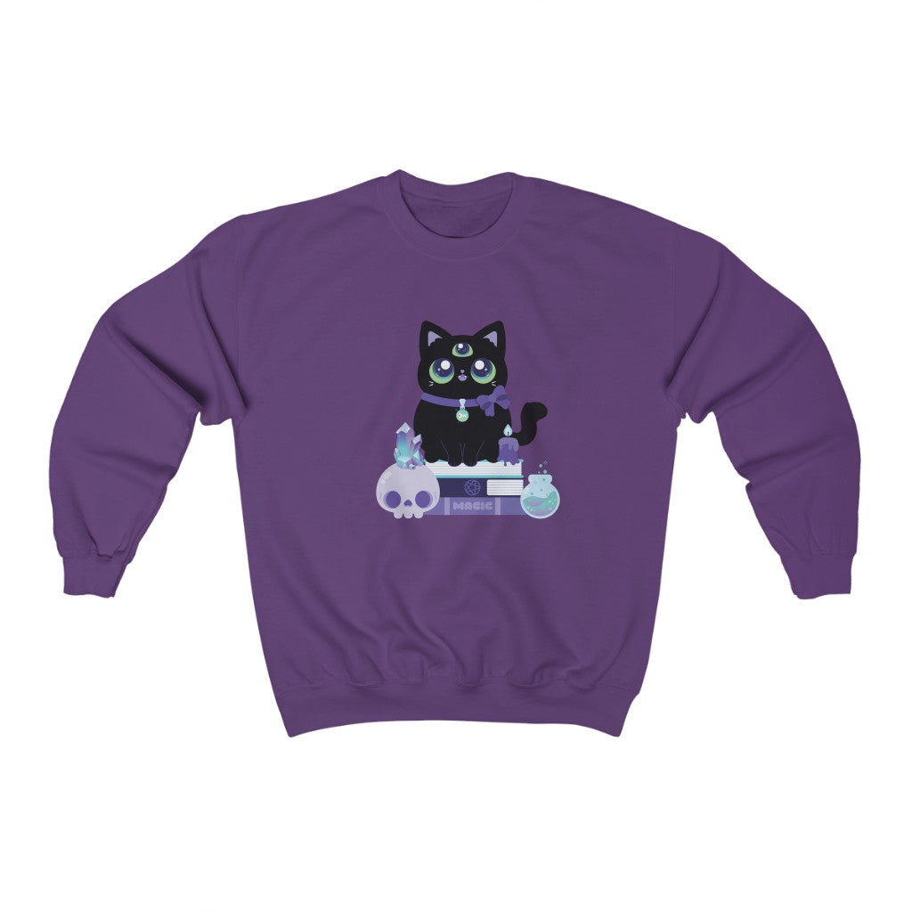 crewneck sweatshirt with a kawii cute three-eyed black cat sitting on a witchy skull
