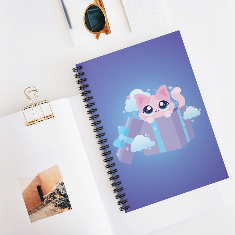 spiral notebook journal with a kawaii cute pink kitty cat in a purple gift box surrounded by small stars and planets