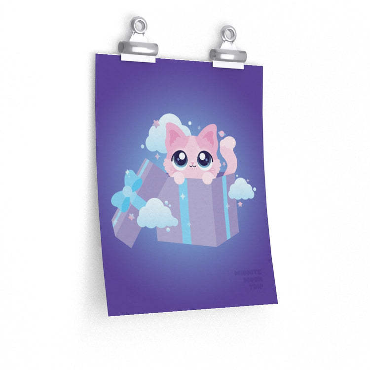 art print of a kawaii cute pink kitty cat in a purple gift box surrounded by small stars and planets