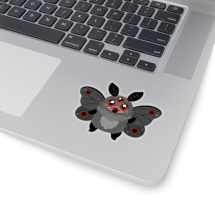 sticker of cute mothman cryptid with glowing red eyes and moth wings