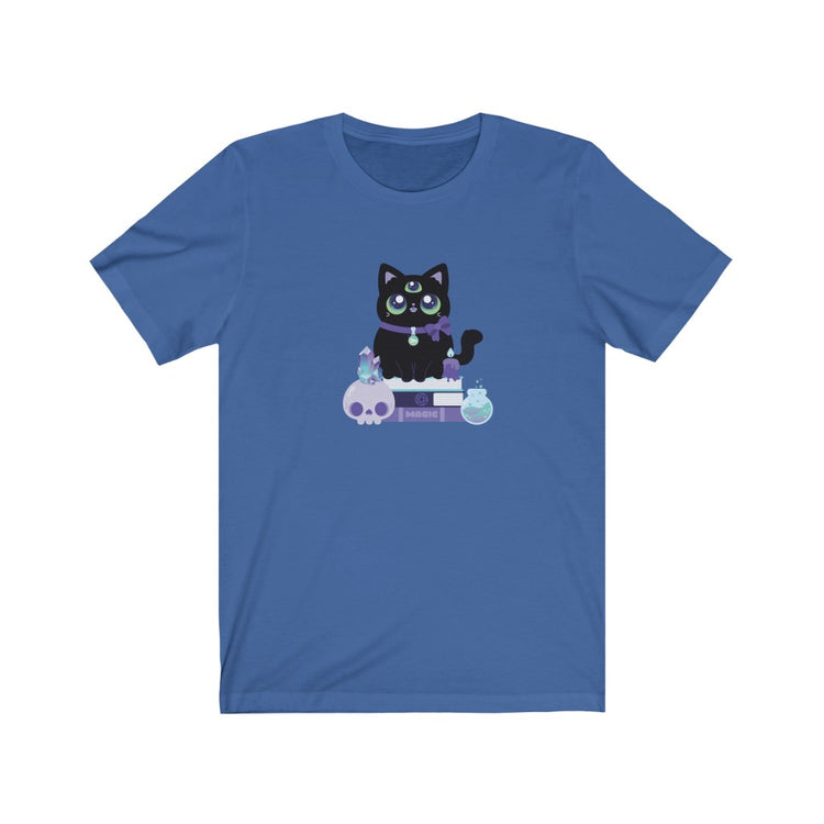 t shirt with a 3-eyed black cat witch with a spooky crystal skull, a magic potion, and a melting candle sitting on a stack of spellbooks