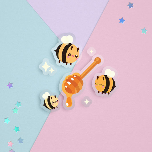 sticker of kawaii cute yellow honey bees with sparkles and a brown wood honey dipper with golden honey drip