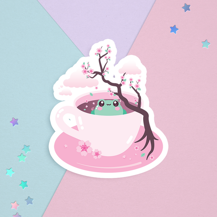 sticker of a tea cup of sakura tea with cherry blossom branch and flowers with a cute green frog  on a pastel background