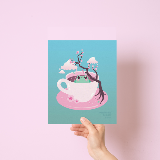 art print with a cute frog sitting in a tea cup with cherry blossoms