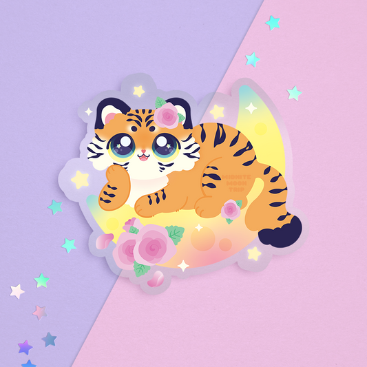 sticker of a cute tiger lying on a crescent moon with pink roses and stars